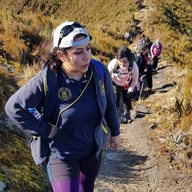 A photo of Saeideh Babashahi from BSMS walking up a mountain/hill with others in the background