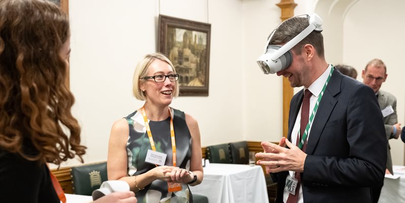 Chris ward mp trying vr with a headset with danya stone and claire smith from bsms in parliament