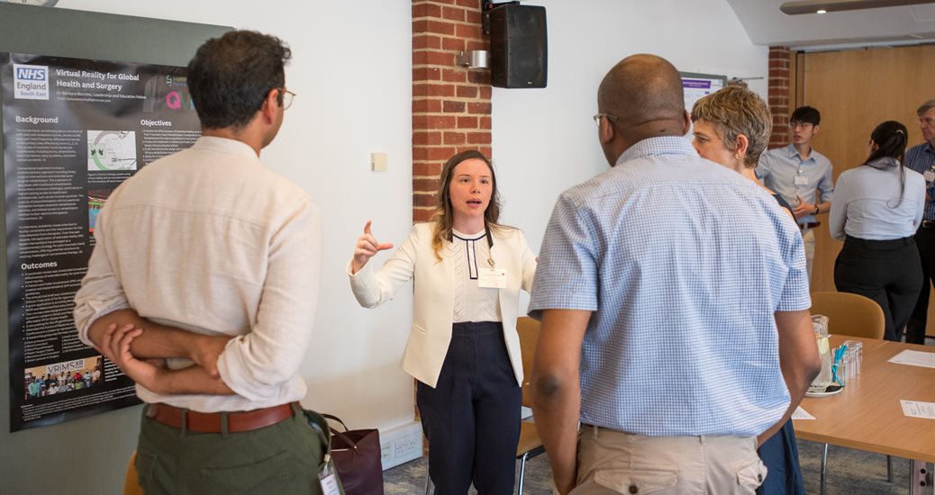 A group of people at an event standing around having a conversation